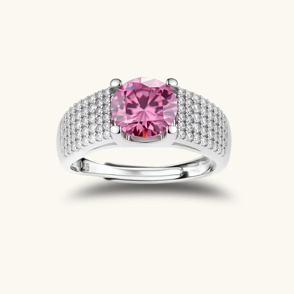 Adjustable sterling silver ring with a round pink moissanite centre stone and pavé crystal detailing.