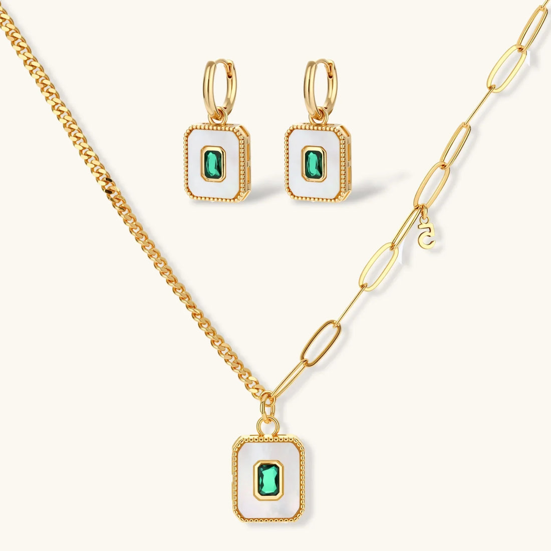 Gold-plated jewellery set with white enamel square pendants and emerald-green cubic zirconia stones.