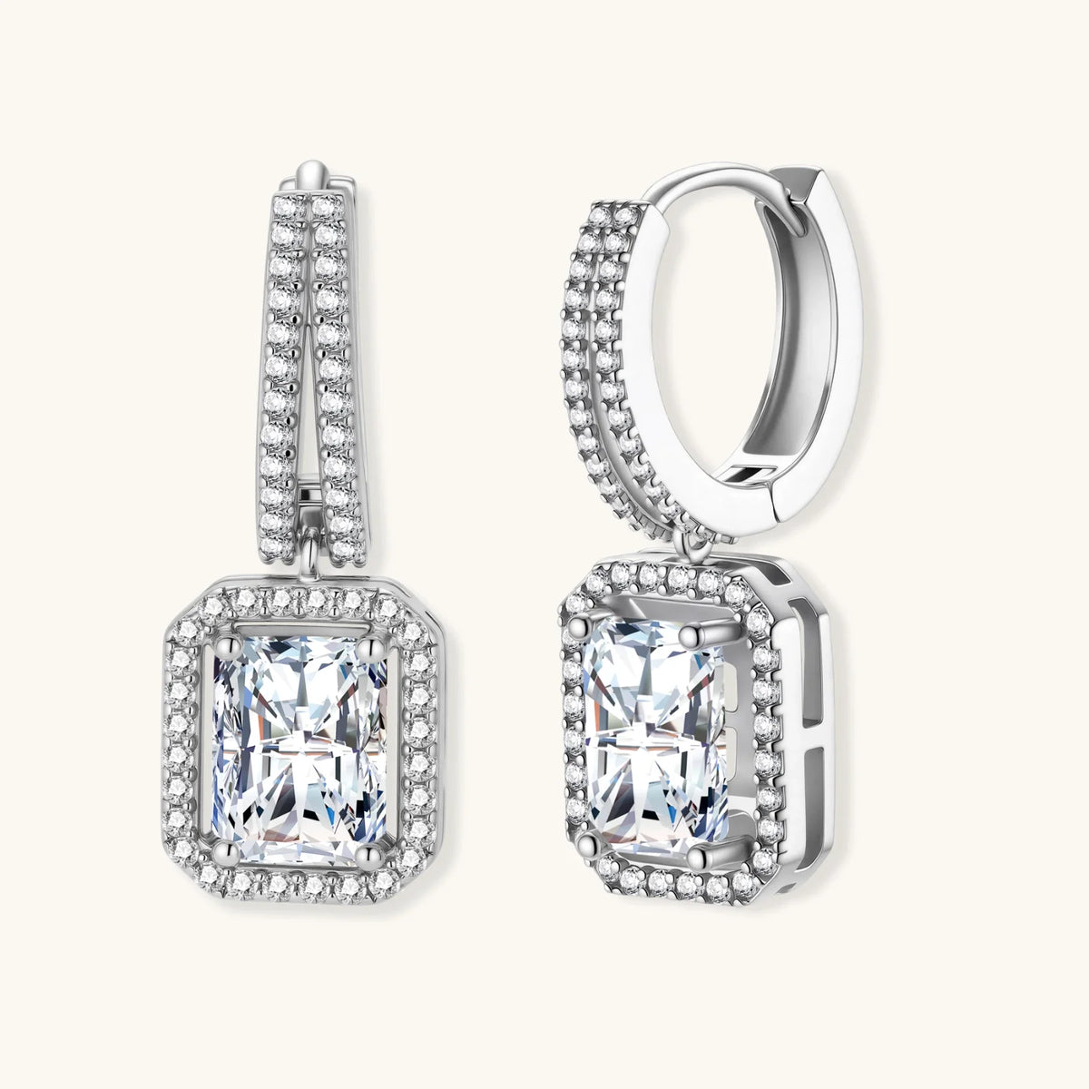 Sterling silver huggie hoops with emerald-cut moissanite drops and pavé-set crystals.