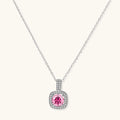 Sterling silver necklace with cushion-cut pink moissanite in diamond halo setting on white background