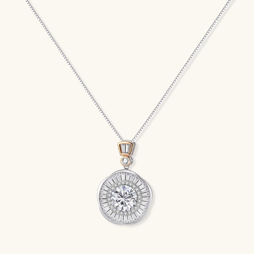Sterling silver necklace with circular geometric pendant featuring central moissanite and radial baguette pattern.