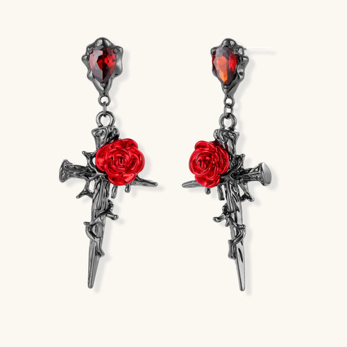 Gothic jewelry set with dark metal thorny cross pendants featuring red enamel roses and matching red crystal earrings