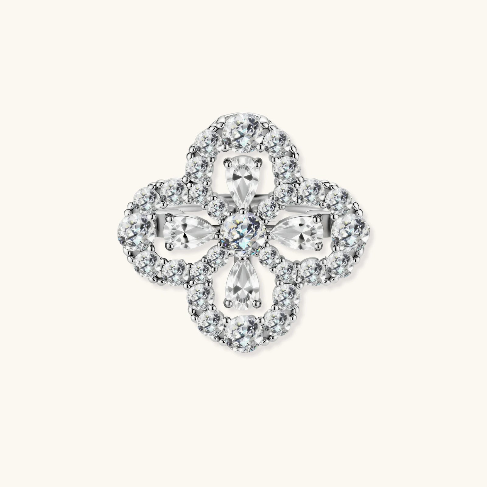 Adjustable sterling silver ring with quatrefoil design featuring brilliant moissanite stones in clover pattern