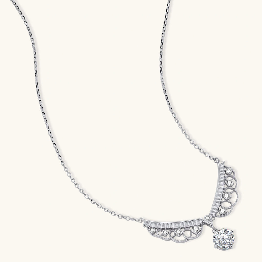Delicate sterling silver necklace with intricate angel wing pendant featuring brilliant moissanite stones in openwork design