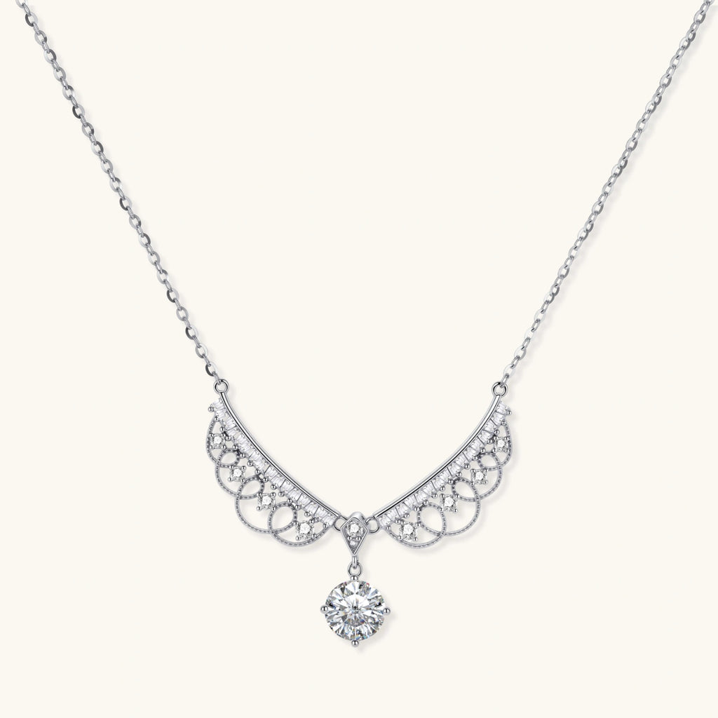 Delicate sterling silver necklace with intricate angel wing pendant featuring brilliant moissanite stones in openwork design