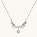 Delicate sterling silver necklace with intricate angel wing pendant featuring brilliant moissanite stones in openwork design
