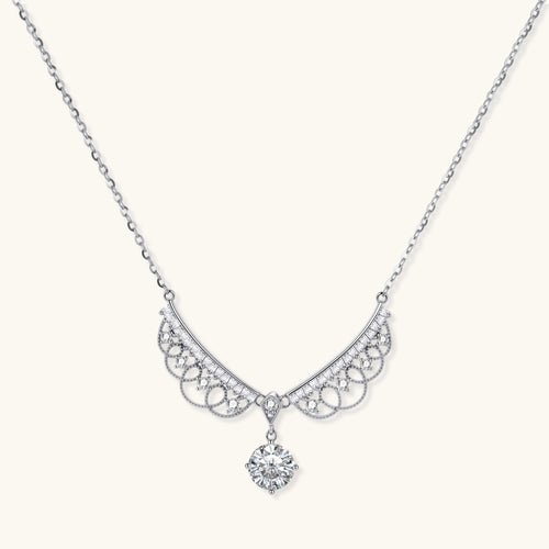 Delicate sterling silver necklace with intricate angel wing pendant featuring brilliant moissanite stones in openwork design