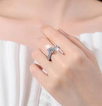 Round Solitaire Petal Side Stone Moissanite Ring in 925 Silver