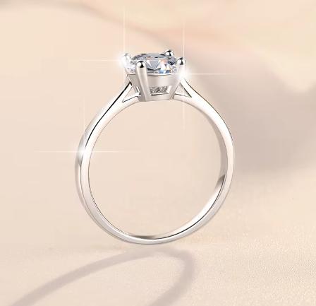 Round Solitaire Baguette Accent Moissanite Ring in 925 Sterling Silver