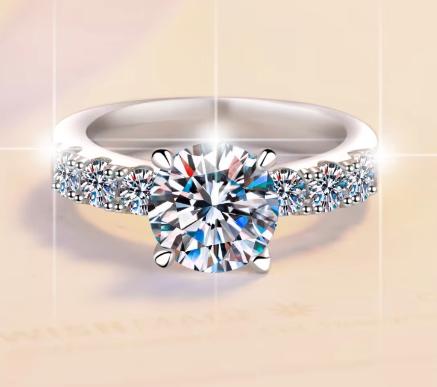Round Solitaire Side Stone Moissanite Ring in 925 Sterling Silver