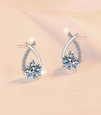 Round Solitaire Crossover Stud Moissanite Earrings in Sterling Silver