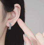 Four Stone Hinged Hoop Moissanite Earrings in Sterling Silver