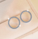 Pavé Circle Stud Moissanite Earrings in Sterling Silver