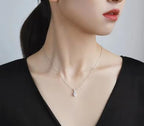 Petite Solitaire with Pavé Bail Sterling Silver Moissanite Pendant, silver-tone
