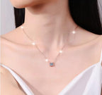 Rose-Tone Solitaire Sterling Silver Moissanite Pendant, rose-tone