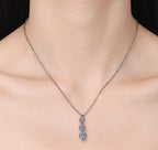 Three-Stone Ribbon Sterling Silver Moissanite Pendant, Silver-tone