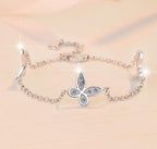 Sterling Silver Moissanite Four Petal Flower Station Bracelet, detail view 1